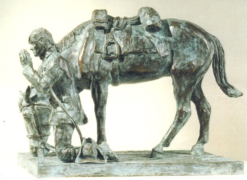 The statuette in profile