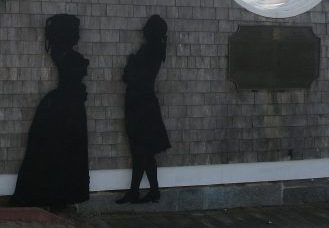 Loyalist silhouettes and plaque on a wall