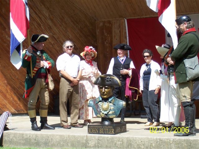 Group Admires Bust of Col. John Butler