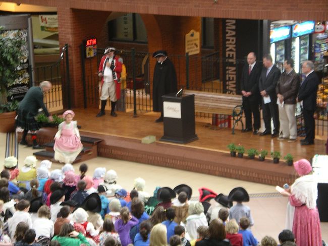 Placing geraniums during the ceremony.