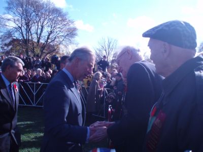 Prince Charles speaking with Okill Stuart